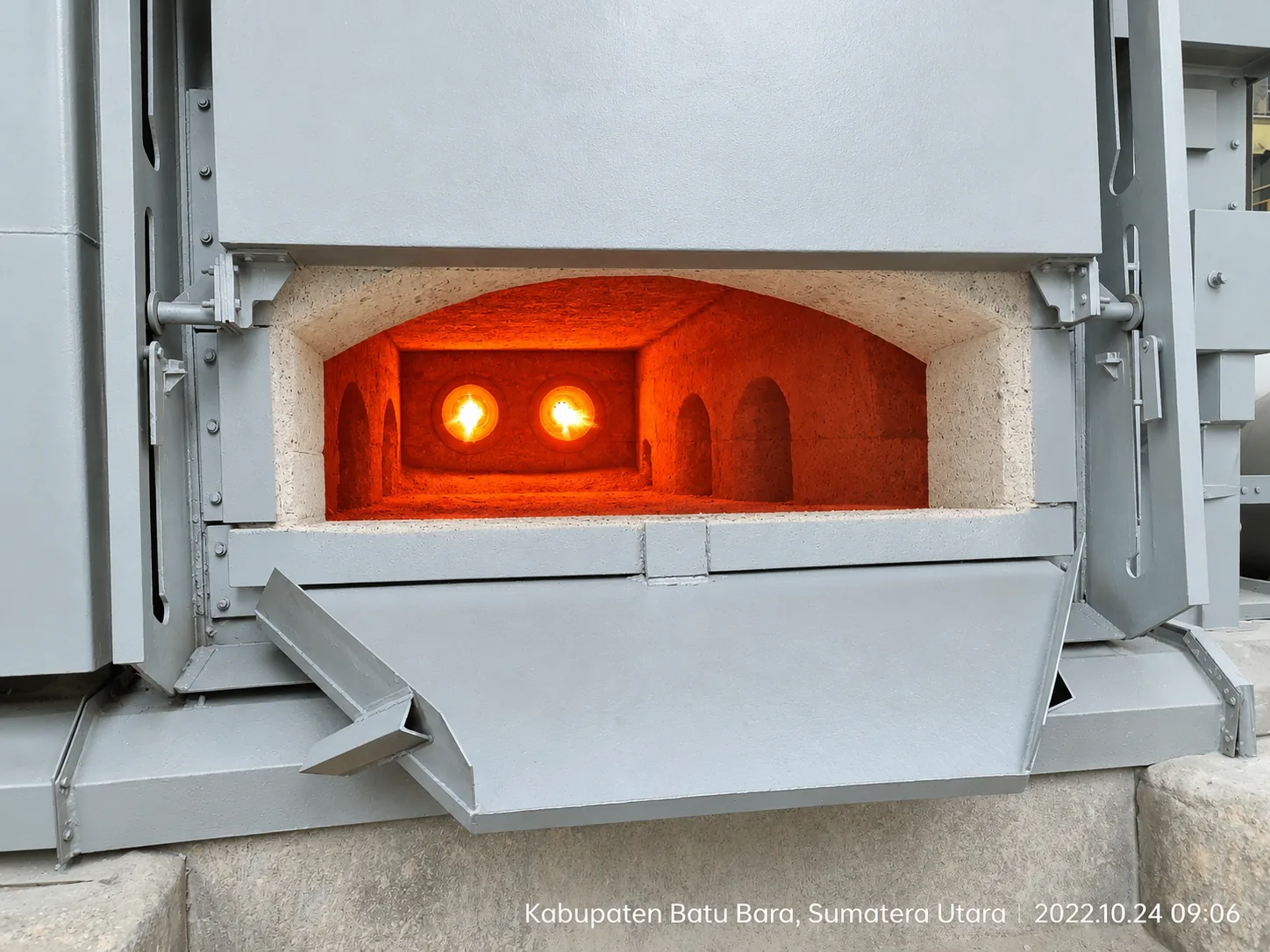 MWT furnace door open showing glowing burners inside the refractory-lined chamber